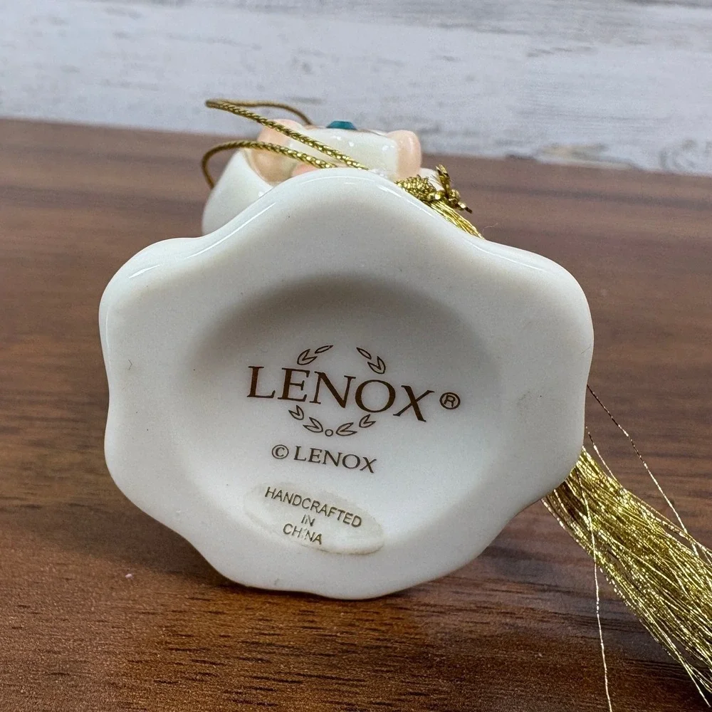 Lenox May birthstone Porcelain Angel Ornament features a hand-painted gold halo